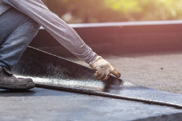 Professional Basement Waterproofing technician working in Weaver, AL